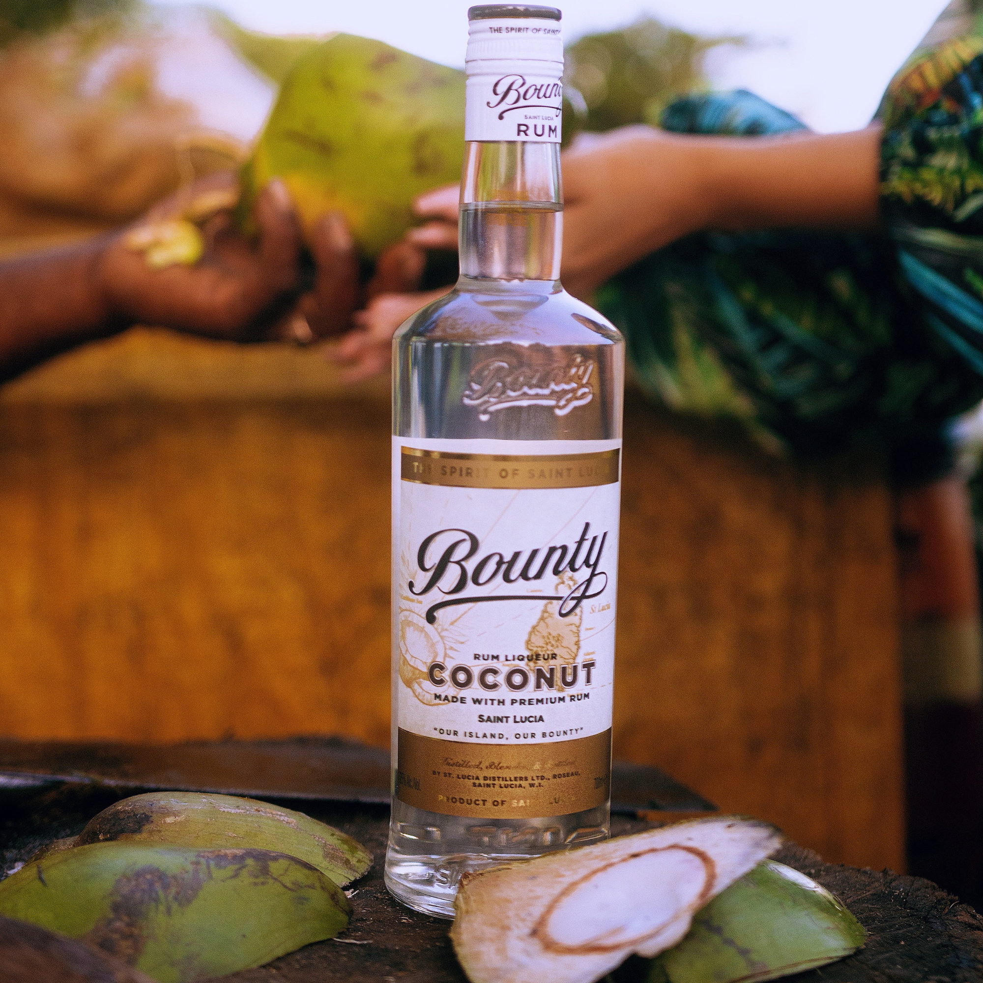 Bottle of Bounty Coconut Rum on a rustic surface with a blurred background