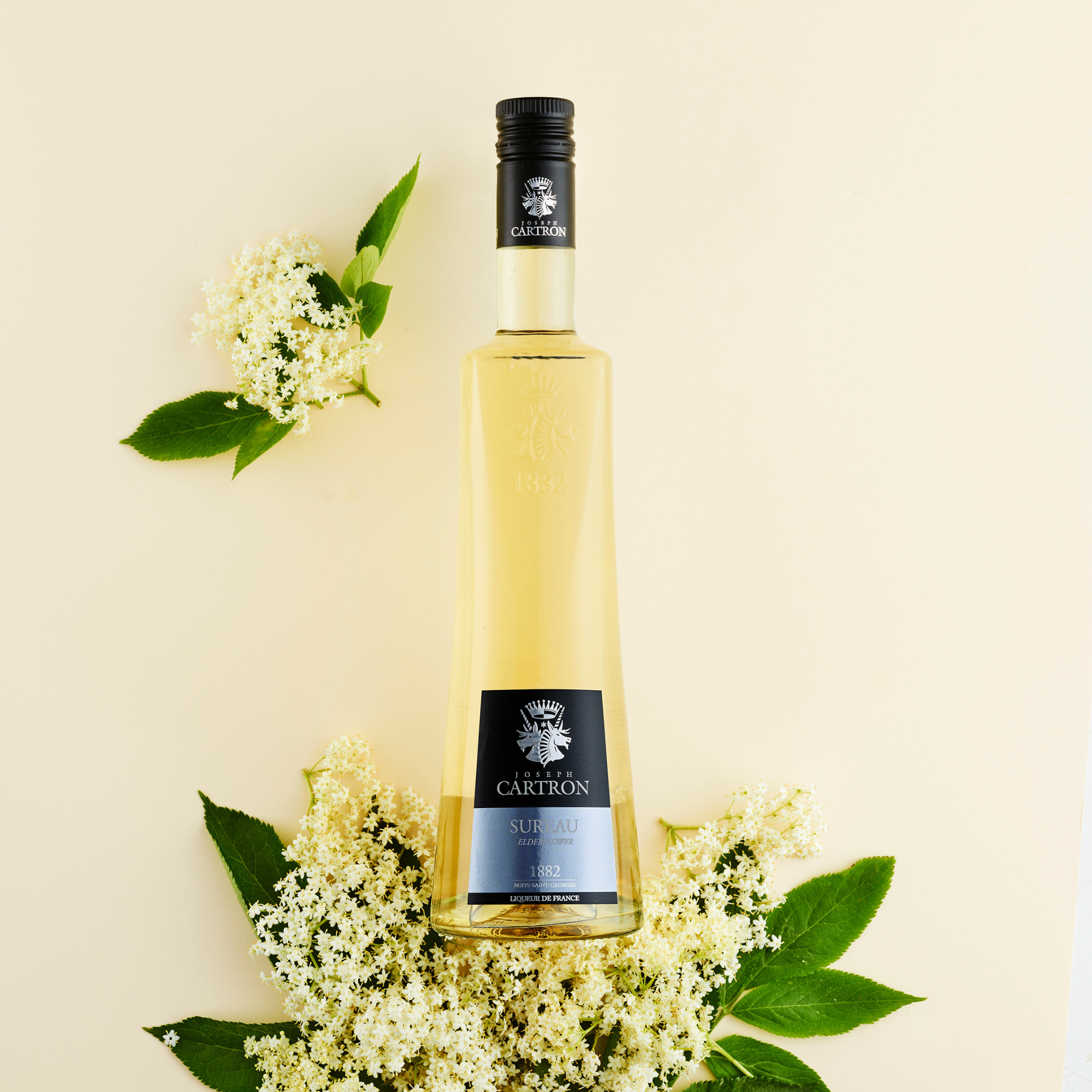 Cartron Sureau Elderflower Liqueur bottle with real elderflower