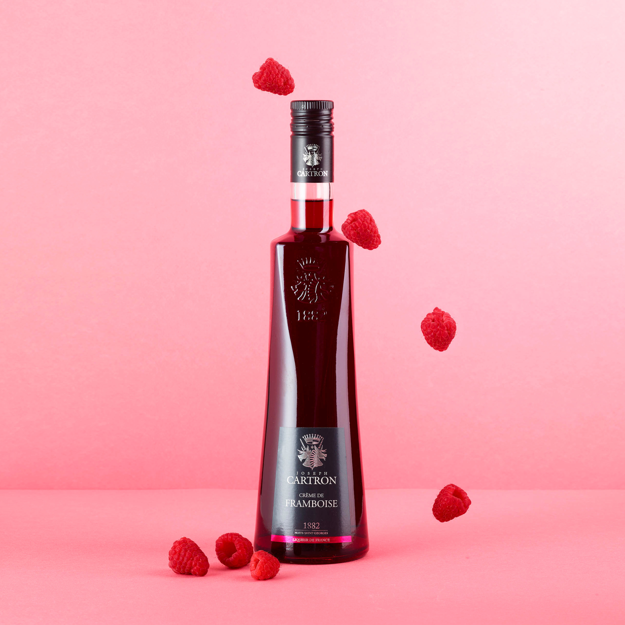 Cartron CremedeFramboise Raspberry Liqueur bottle with real raspberries 
