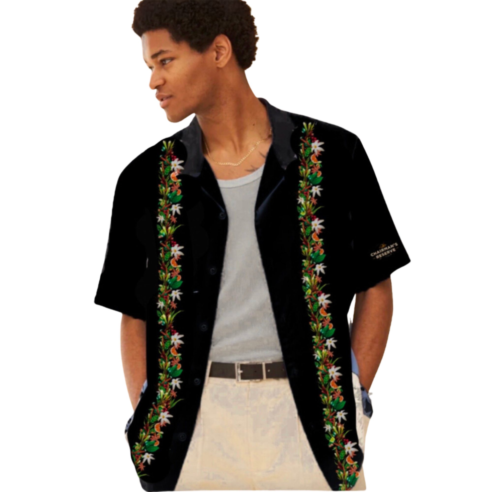 Man wearing a black embroidered shirt with floral designs on a white background