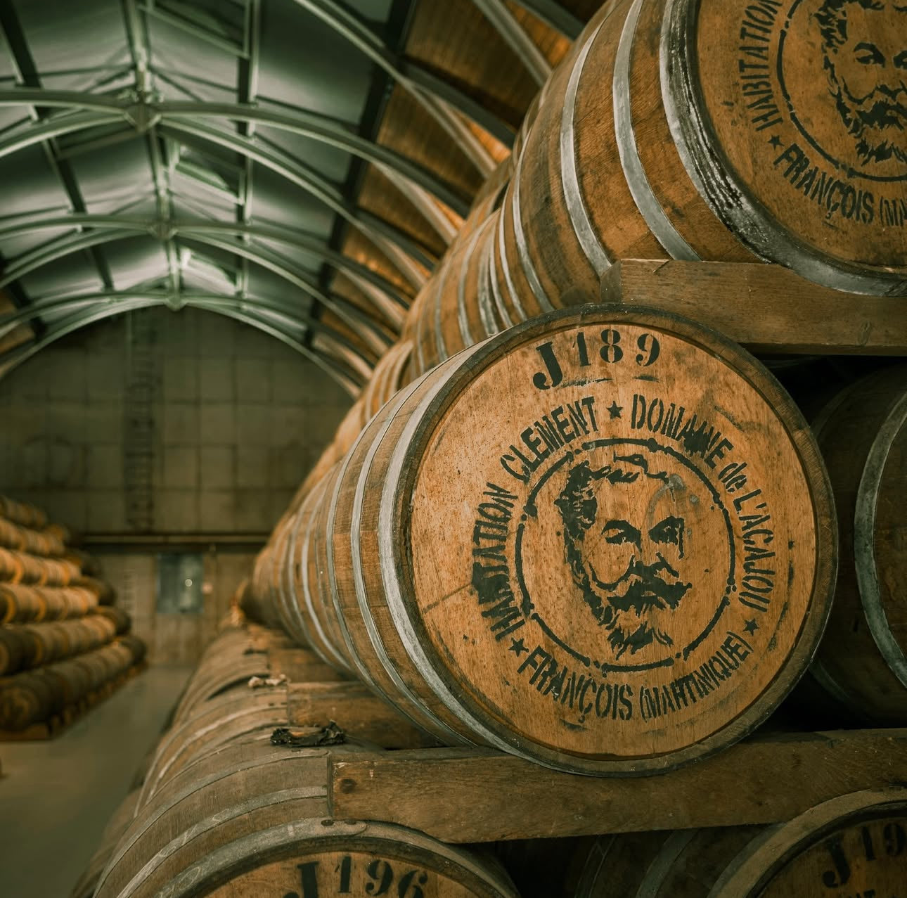 Wooden barrels with branding in a warehouse setting