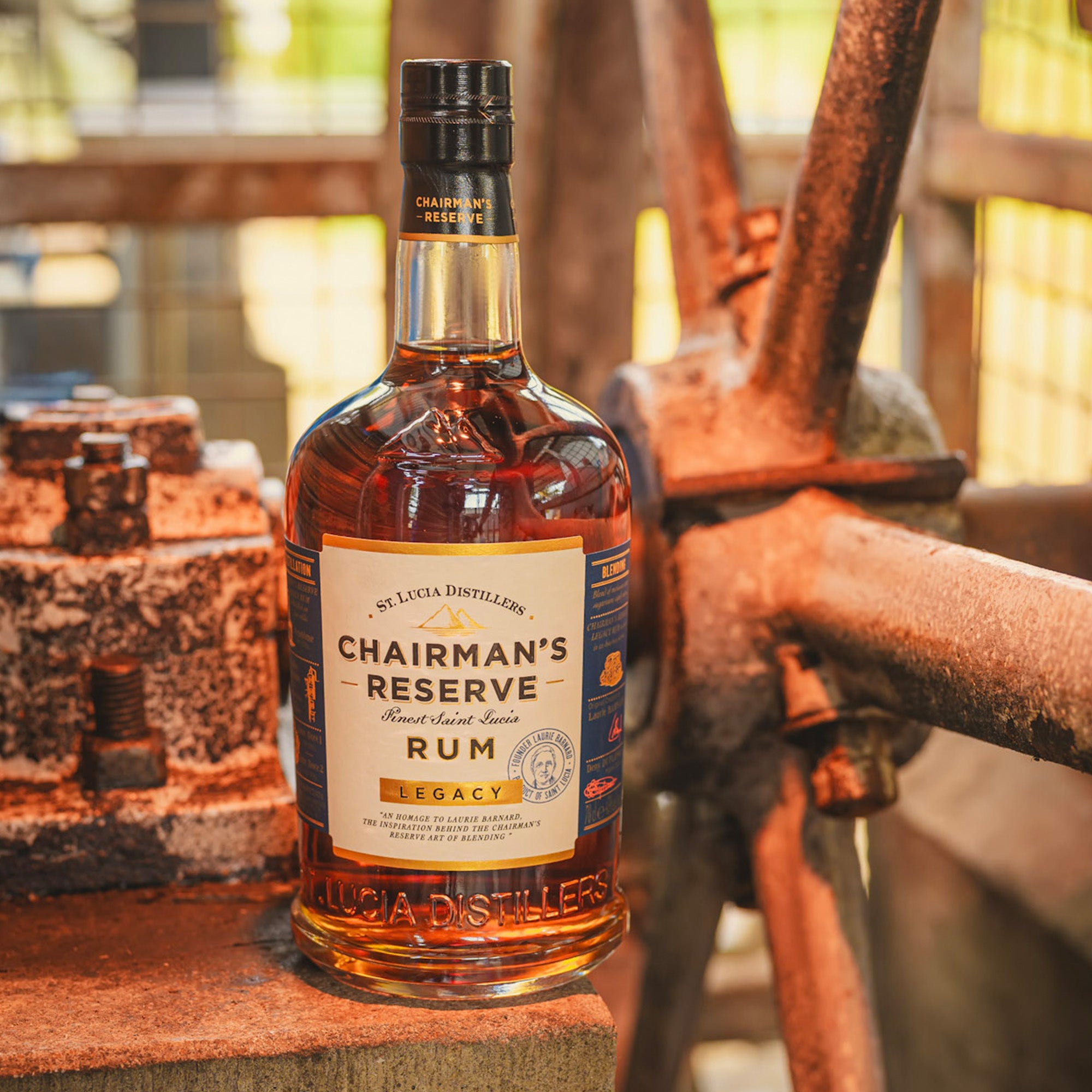 Bottle of Chairman's Reserve Legacy Rum on a rustic background